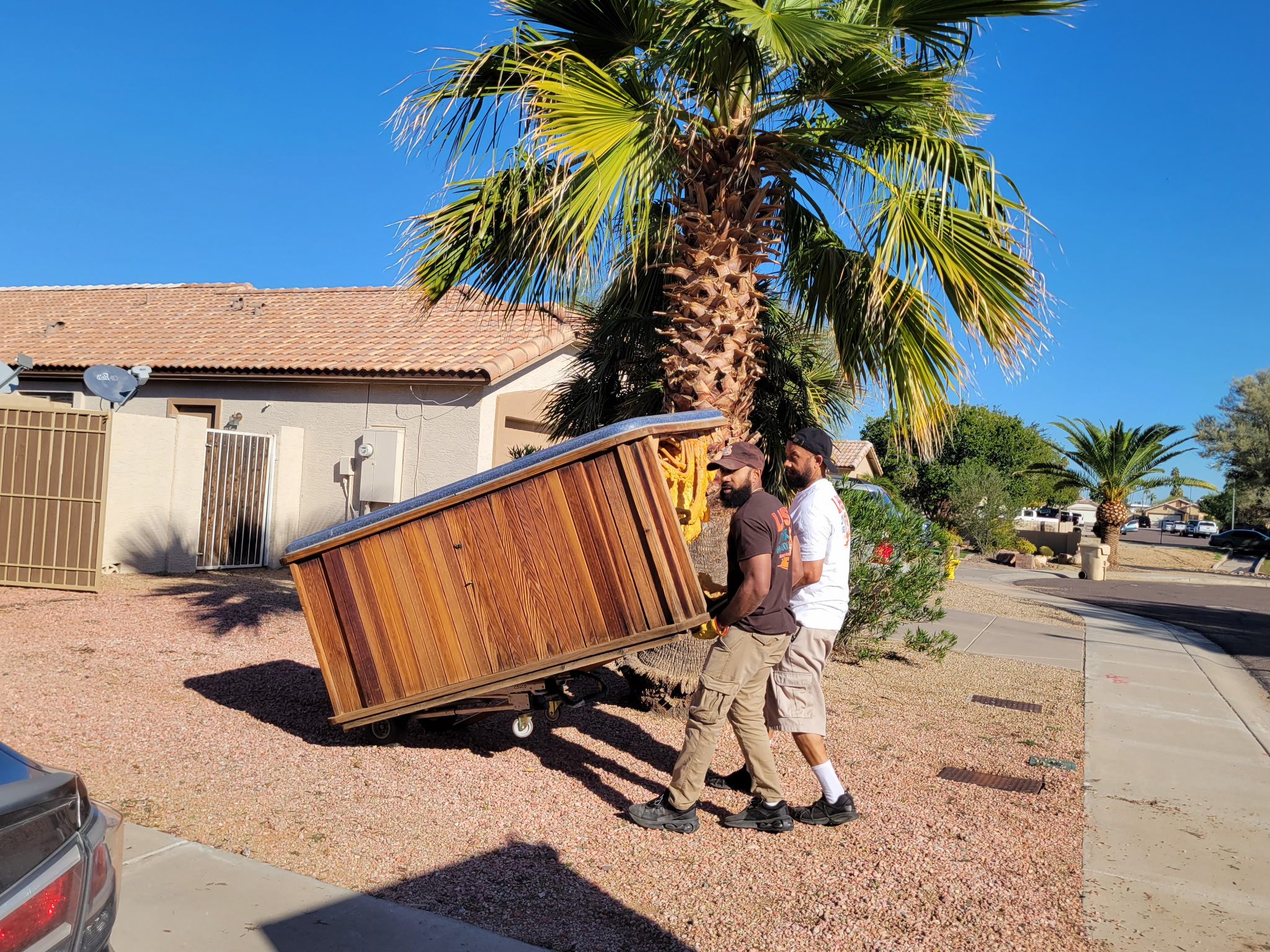 men carrying junk